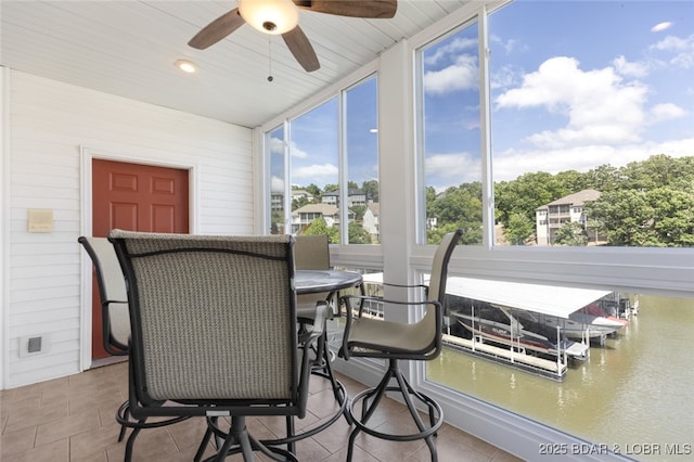 289 Charleston Dr Unit 2B, Lake Ozark, MO 65049 - sunroom featuring tile patterned floors and a water view