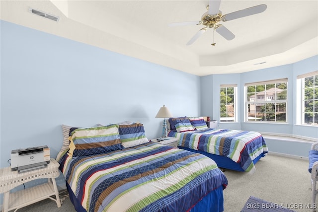 289 Charleston Dr Unit 2B, Lake Ozark, MO 65049 - bedroom featuring carpet floors, a raised ceiling, and ceiling fan