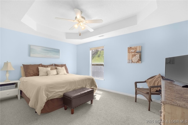 289 Charleston Dr Unit 2B, Lake Ozark, MO 65049 - bedroom with a tray ceiling, light carpet, ceiling fan, and baseboards