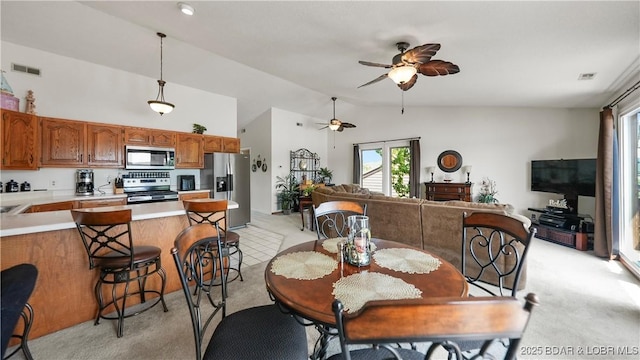 111 Rock Dove Ln Unit 3A, Camdenton, MO 65020 - dining room with light carpet, a ceiling fan, plenty of natural light, and high vaulted ceiling