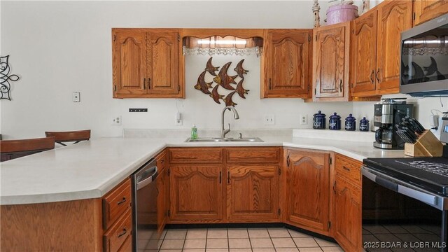 111 Rock Dove Ln Unit 3A, Camdenton, MO 65020 - kitchen with appliances with stainless steel finishes, a sink, brown cabinetry, and light tile patterned floors