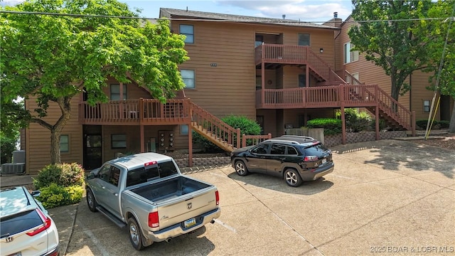 111 Rock Dove Ln Unit 3A, Camdenton, MO 65020 - view of property with stairway and uncovered parking