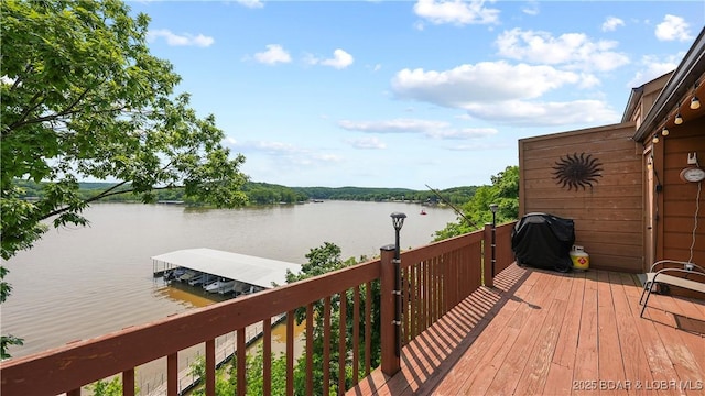 111 Rock Dove Ln Unit 3A, Camdenton, MO 65020 - wooden terrace with a water view, grilling area, and a boat dock