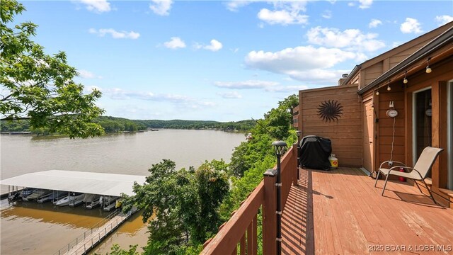 111 Rock Dove Ln Unit 3A, Camdenton, MO 65020 - deck with a water view, grilling area, and a boat dock