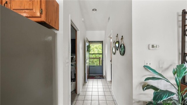 111 Rock Dove Ln Unit 3A, Camdenton, MO 65020 - hallway featuring light tile patterned floors and baseboards