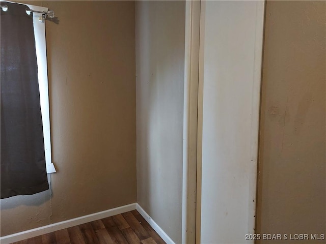 203 3rd St, Stover, MO 65078 - empty room featuring dark wood finished floors and baseboards