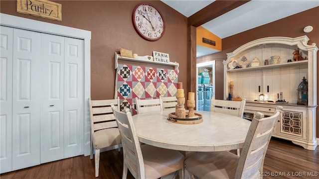660 Upper Prairie Hollow Rd, Macks Creek, MO 65786 - dining space featuring dark wood-type flooring and bar area