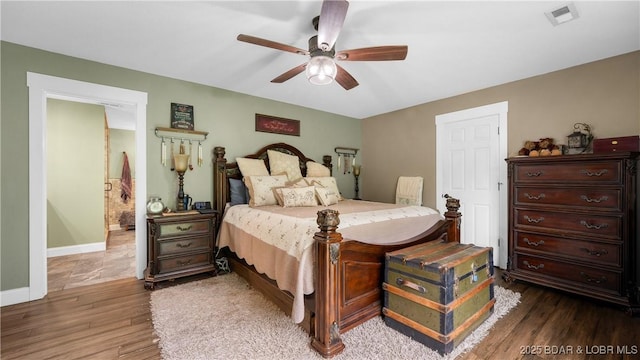 660 Upper Prairie Hollow Rd, Macks Creek, MO 65786 - bedroom with wood finished floors, baseboards, and ceiling fan