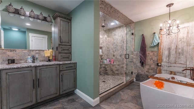 660 Upper Prairie Hollow Rd, Macks Creek, MO 65786 - full bathroom featuring a freestanding bath, a stall shower, vanity, and stone finish flooring
