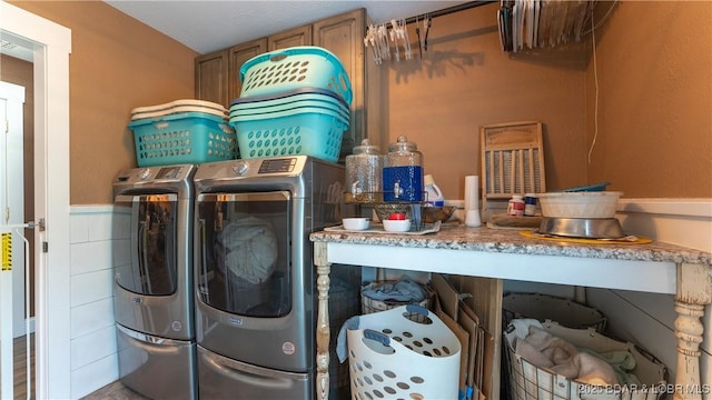 660 Upper Prairie Hollow Rd, Macks Creek, MO 65786 - laundry area featuring washing machine and dryer and a wainscoted wall