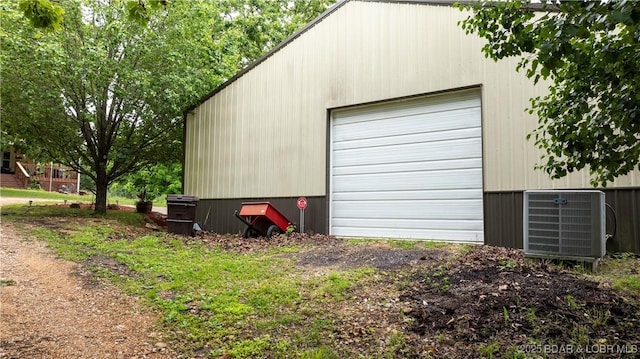 660 Upper Prairie Hollow Rd, Macks Creek, MO 65786 - detached garage featuring cooling unit and driveway
