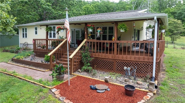 660 Upper Prairie Hollow Rd, Macks Creek, MO 65786 - ranch-style house with roof with shingles and a deck