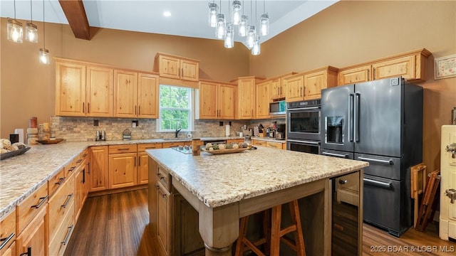 660 Upper Prairie Hollow Rd, Macks Creek, MO 65786 - kitchen featuring stainless steel appliances, light brown cabinets, dark wood-style floors, a sink, and beam ceiling
