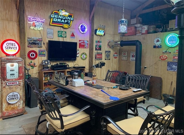 660 Upper Prairie Hollow Rd, Macks Creek, MO 65786 - dining space featuring wooden walls and concrete floors