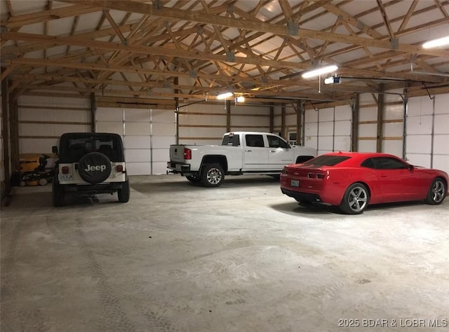 660 Upper Prairie Hollow Rd, Macks Creek, MO 65786 - garage featuring a garage door opener
