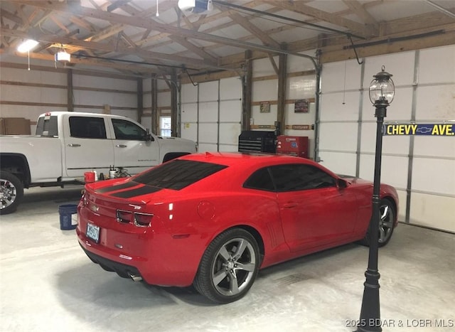 660 Upper Prairie Hollow Rd, Macks Creek, MO 65786 - garage with a garage door opener