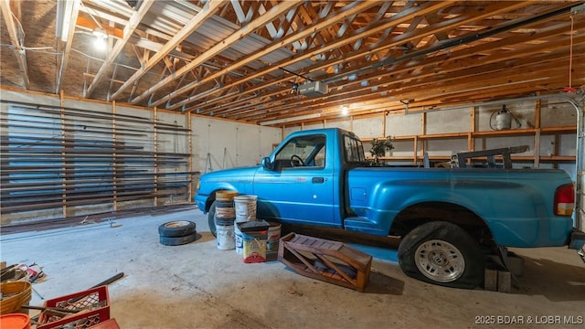 864 Four Waters Dr, Sunrise Beach, MO 65079 - garage with a garage door opener