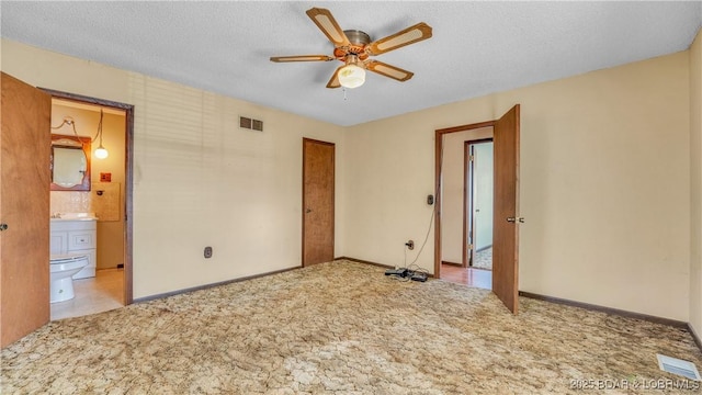 864 Four Waters Dr, Sunrise Beach, MO 65079 - spare room featuring carpet flooring, a ceiling fan, baseboards, and a textured ceiling