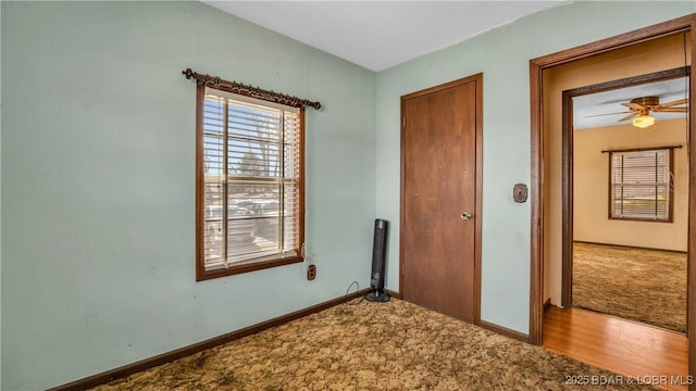 864 Four Waters Dr, Sunrise Beach, MO 65079 - unfurnished bedroom with carpet and baseboards