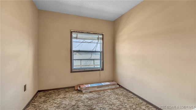 864 Four Waters Dr, Sunrise Beach, MO 65079 - unfurnished room with carpet, baseboards, and a textured ceiling