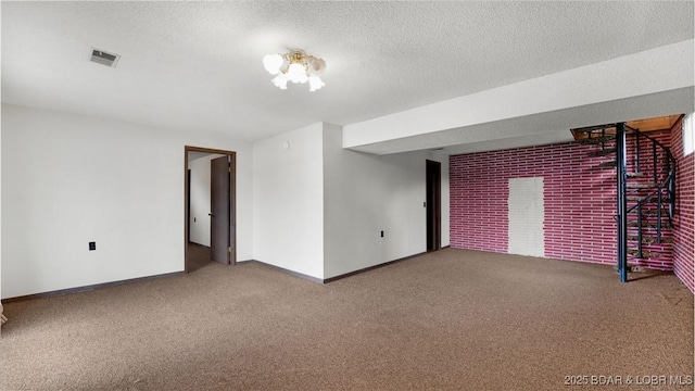 864 Four Waters Dr, Sunrise Beach, MO 65079 - carpeted empty room with baseboards, a textured ceiling, and brick wall