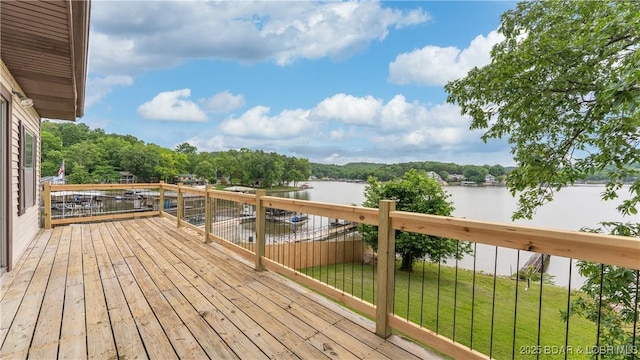 864 Four Waters Dr, Sunrise Beach, MO 65079 - wooden deck featuring a water view and a lawn