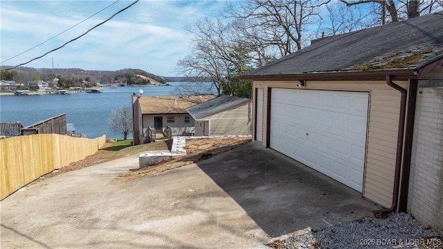 864 Four Waters Dr, Sunrise Beach, MO 65079 - detached garage with a water view