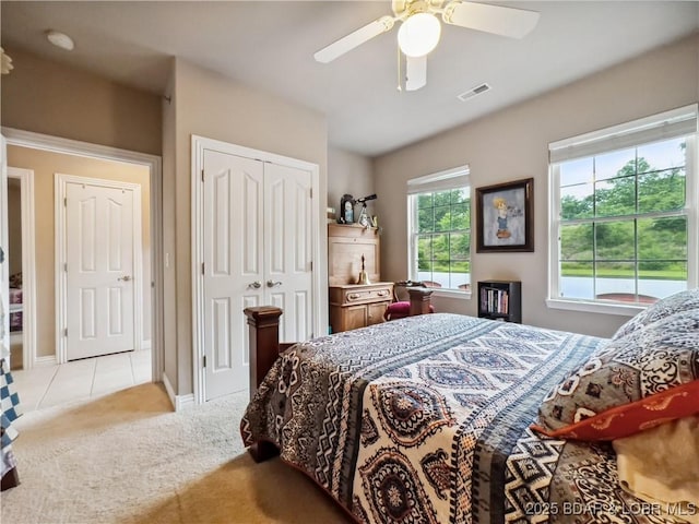 134 Heavenly Days Cir Unit 3A, Camdenton, MO 65020 - bedroom featuring carpet, a closet, a ceiling fan, tile patterned floors, and baseboards