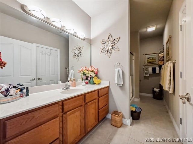 134 Heavenly Days Cir Unit 3A, Camdenton, MO 65020 - bathroom with tile patterned floors, vanity, a shower stall, and baseboards