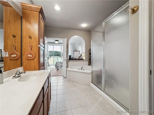 134 Heavenly Days Cir Unit 3A, Camdenton, MO 65020 - full bath featuring vanity, a shower stall, a garden tub, and tile patterned flooring