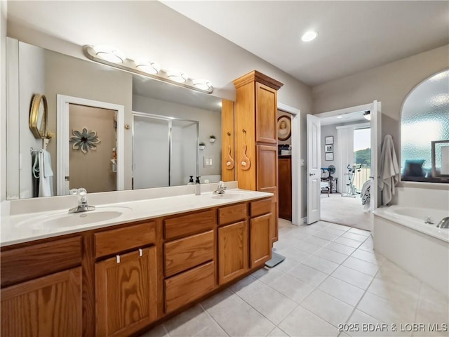 134 Heavenly Days Cir Unit 3A, Camdenton, MO 65020 - bathroom featuring a stall shower, double vanity, a garden tub, tile patterned floors, and recessed lighting