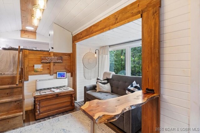 34546 Ivy Bend Rd, Stover, MO 65018 - living area with wood walls, wood finished floors, vaulted ceiling, and wood ceiling