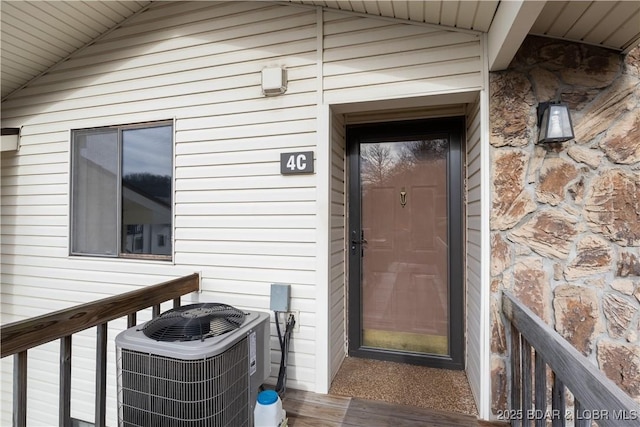 98 Jonathan Dr Unit 4C, Lake Ozark, MO 65049 - view of exterior entry featuring central AC unit
