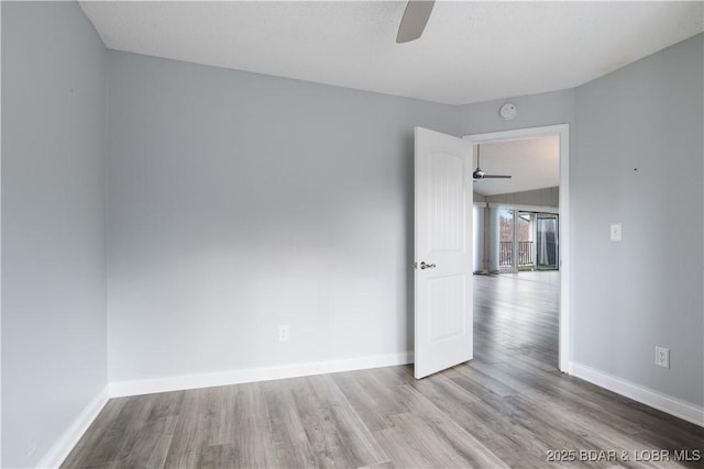 98 Jonathan Dr Unit 4C, Lake Ozark, MO 65049 - unfurnished room with ceiling fan, wood finished floors, and baseboards