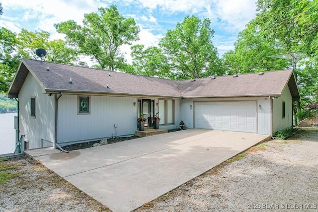 42 Rhine River Rd, Sunrise Beach, MO 65079 - single story home with an attached garage, driveway, and roof with shingles