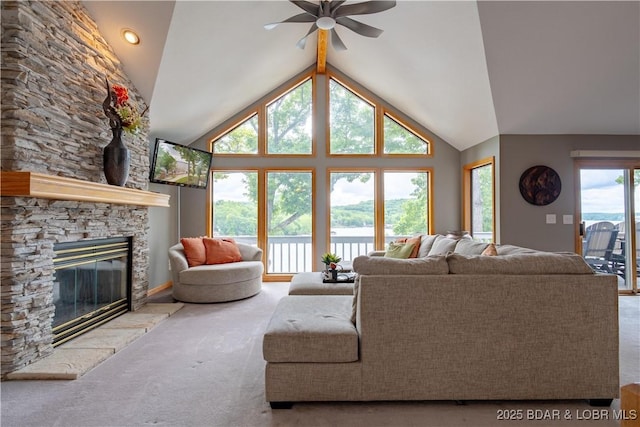 42 Rhine River Rd, Sunrise Beach, MO 65079 - living area with a ceiling fan, carpet flooring, lofted ceiling, and a stone fireplace