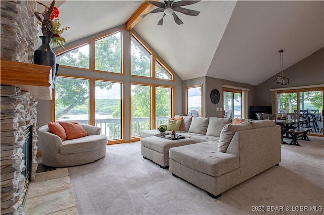 42 Rhine River Rd, Sunrise Beach, MO 65079 - living area featuring a fireplace, a ceiling fan, carpet flooring, high vaulted ceiling, and beam ceiling