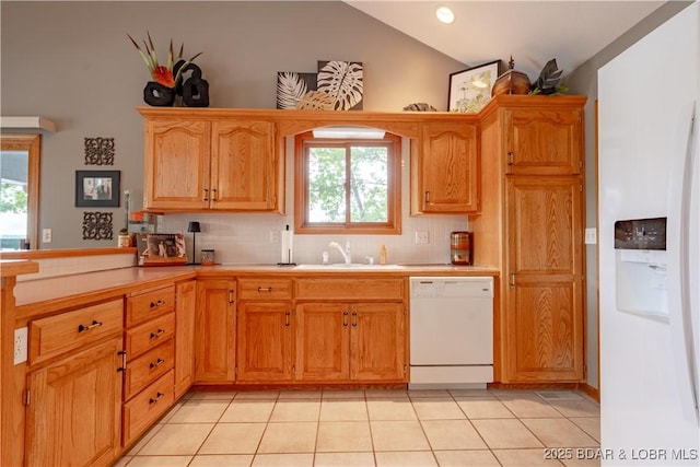 42 Rhine River Rd, Sunrise Beach, MO 65079 - kitchen with white dishwasher, a sink, lofted ceiling, decorative backsplash, and light countertops