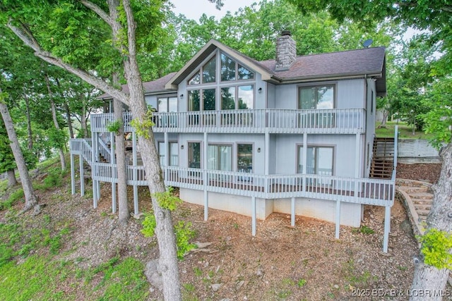 42 Rhine River Rd, Sunrise Beach, MO 65079 - rear view of house with stairway, a chimney, a balcony, and roof with shingles