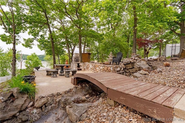 42 Rhine River Rd, Sunrise Beach, MO 65079 - wooden terrace with an outdoor stone fireplace and a patio