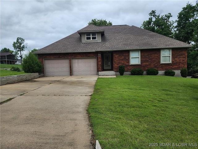 105 Birdie Dr, Gravois Mills, MO 65037 - view of front of property featuring a shingled roof, concrete driveway, a front yard, and a garage