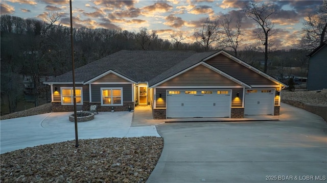 866 Fontana Ln, Linn Creek, MO 65052 - craftsman-style house with driveway, an attached garage, and stone siding