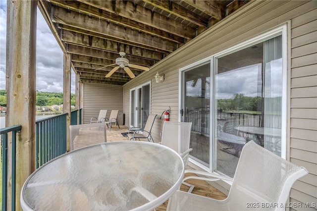 272 Cedar Glen Dr Unit 3A, Camdenton, MO 65020 - wooden deck with outdoor dining area and a ceiling fan