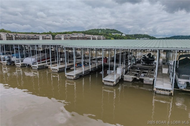272 Cedar Glen Dr Unit 3A, Camdenton, MO 65020 - dock featuring boat lift and a water view