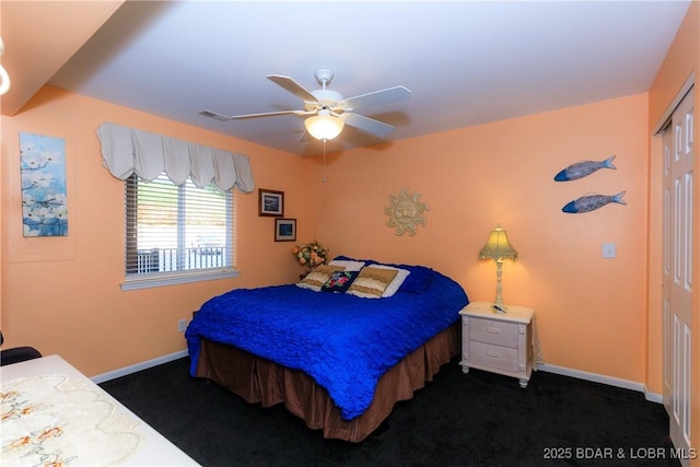 164 Park Place Ln Unit 3D, Kaiser, MO 65047 - bedroom with dark colored carpet, a closet, and baseboards