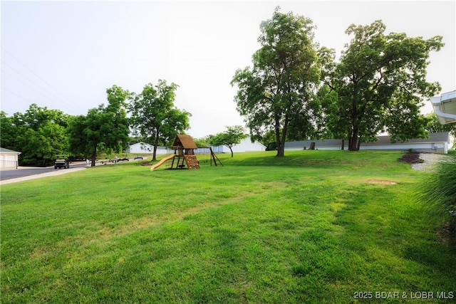 164 Park Place Ln Unit 3D, Kaiser, MO 65047 - view of green lawn with a playground
