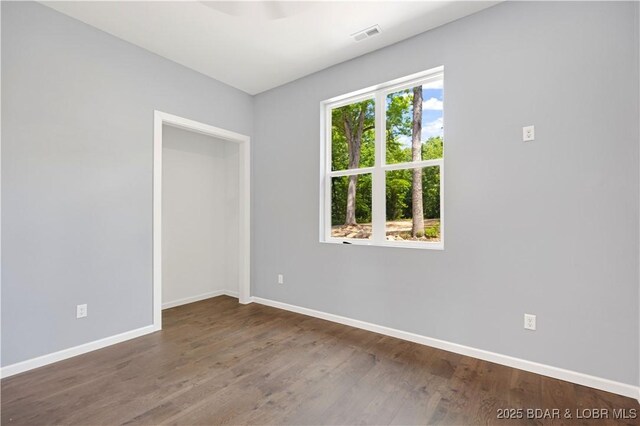 19580 Wonderland Rd, Rocky Mount, MO 65072 - empty room featuring baseboards and wood finished floors