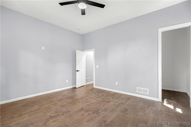 19580 Wonderland Rd, Rocky Mount, MO 65072 - unfurnished room with a ceiling fan, wood finished floors, and baseboards
