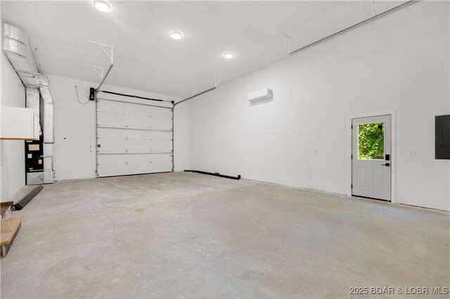 19580 Wonderland Rd, Rocky Mount, MO 65072 - garage featuring electric panel and a wall mounted AC