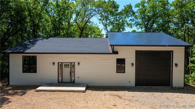 19580 Wonderland Rd, Rocky Mount, MO 65072 - view of front of home with driveway and an attached garage